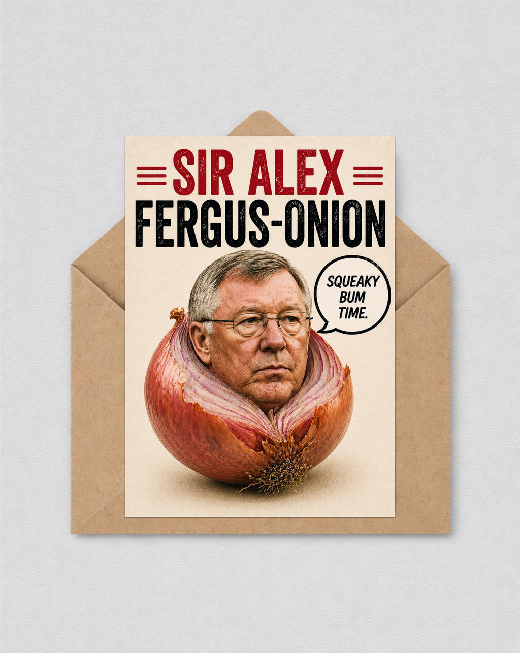 May include: A humorous greeting card with a picture of a man's face inside a red onion. The card reads "SIR ALEX FERGUS-ONION" in red and black text. A speech bubble says "SQUEAKY BUM TIME."
