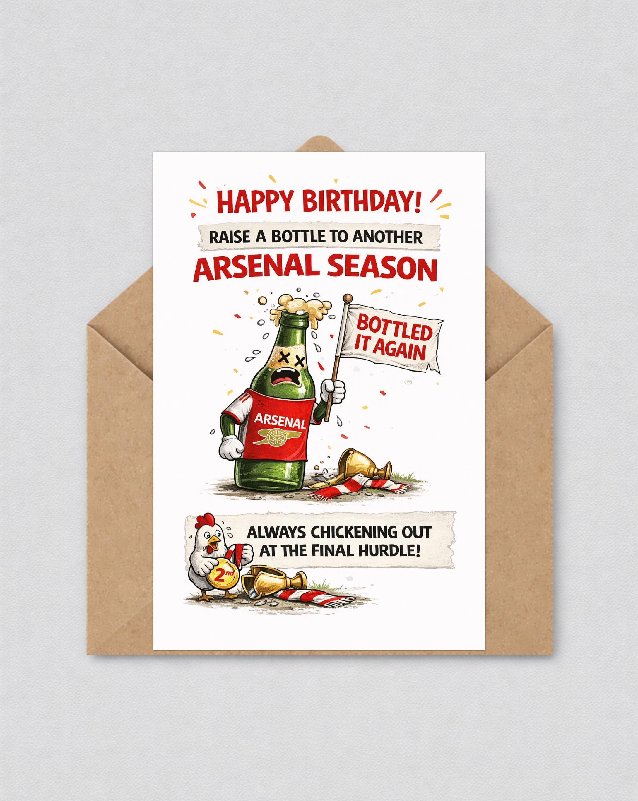 May include: A birthday card with a cartoon beer bottle wearing an Arsenal shirt, holding a flag that says "Bottled It Again." The card has text that reads "Happy Birthday!" and "Always chickening out at the final hurdle!" in red.