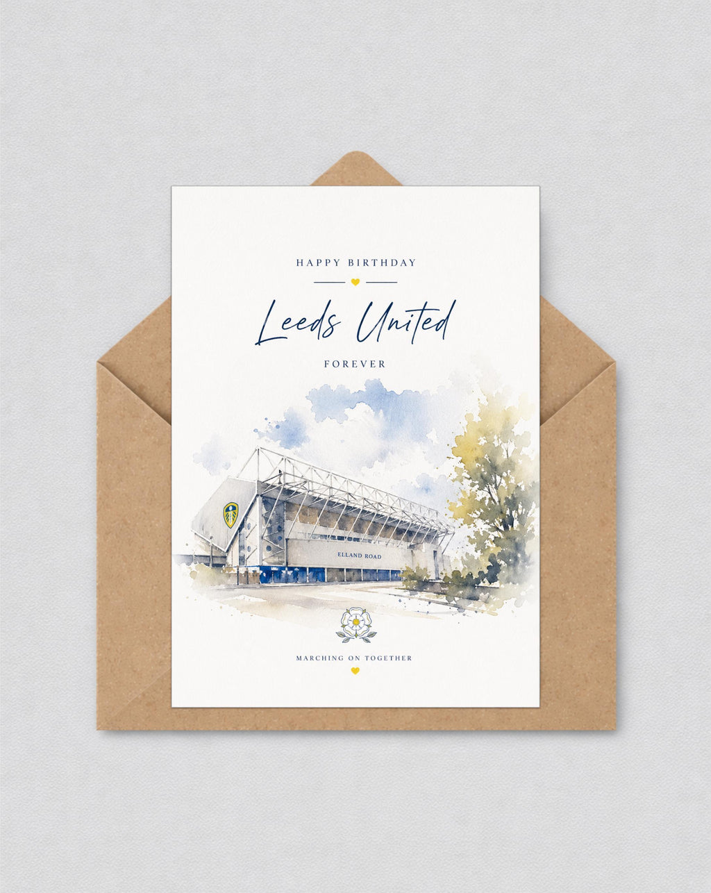 May include: A birthday card with a watercolour illustration of the Leeds United stadium, with the text "Happy Birthday Leeds United Forever." The card is in a brown envelope. The stadium is shown in white and blue.
