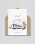 May include: A birthday card with a watercolour illustration of the Leeds United stadium, with the text "Happy Birthday Leeds United Forever." The card is in a brown envelope. The stadium is shown in white and blue.